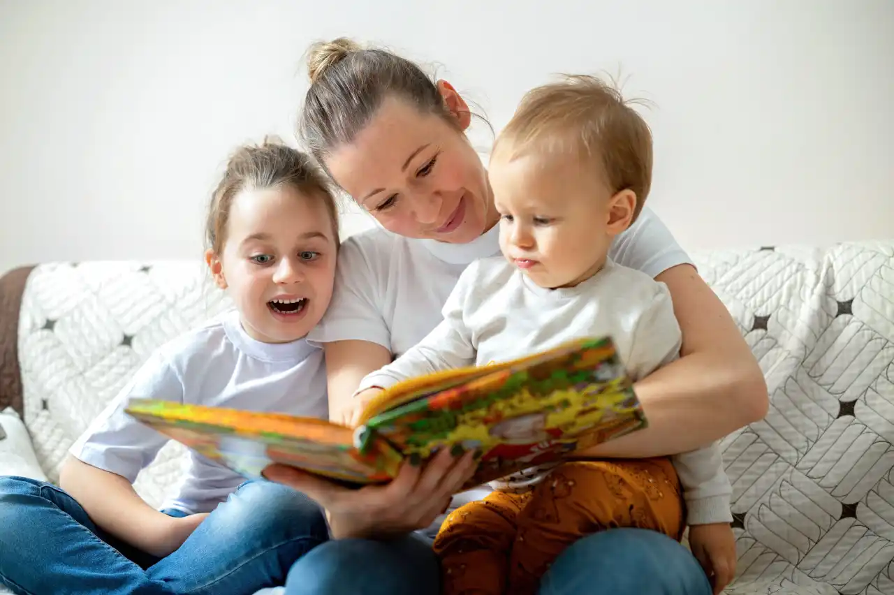 Children enjoying story time in a cosy classroom corner